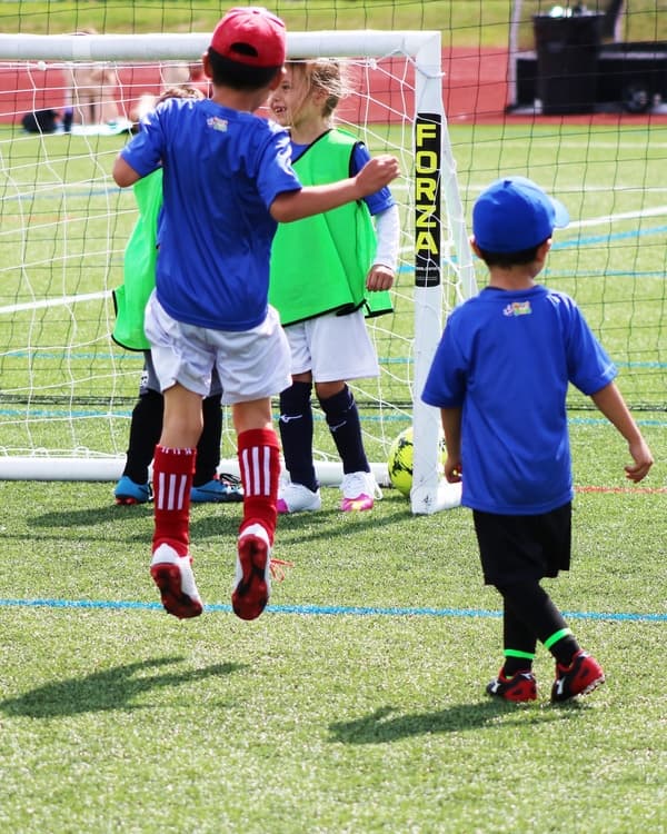 Youth Soccer League Player Scoring A Goal