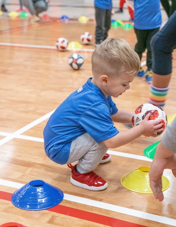 Toddler Playing A Color Match Game